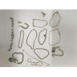 A collection of14 silver bracelets.