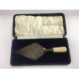 A cased silver trowel commemorating the laying of the corner stone of The Church of All Saints,