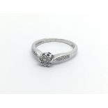 A 9carat white gold ring set with a solitaire diamond ring size L-M