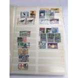 A stamp album containing mixed world stamps.