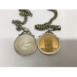 Two Albert watch chain with attached coins .