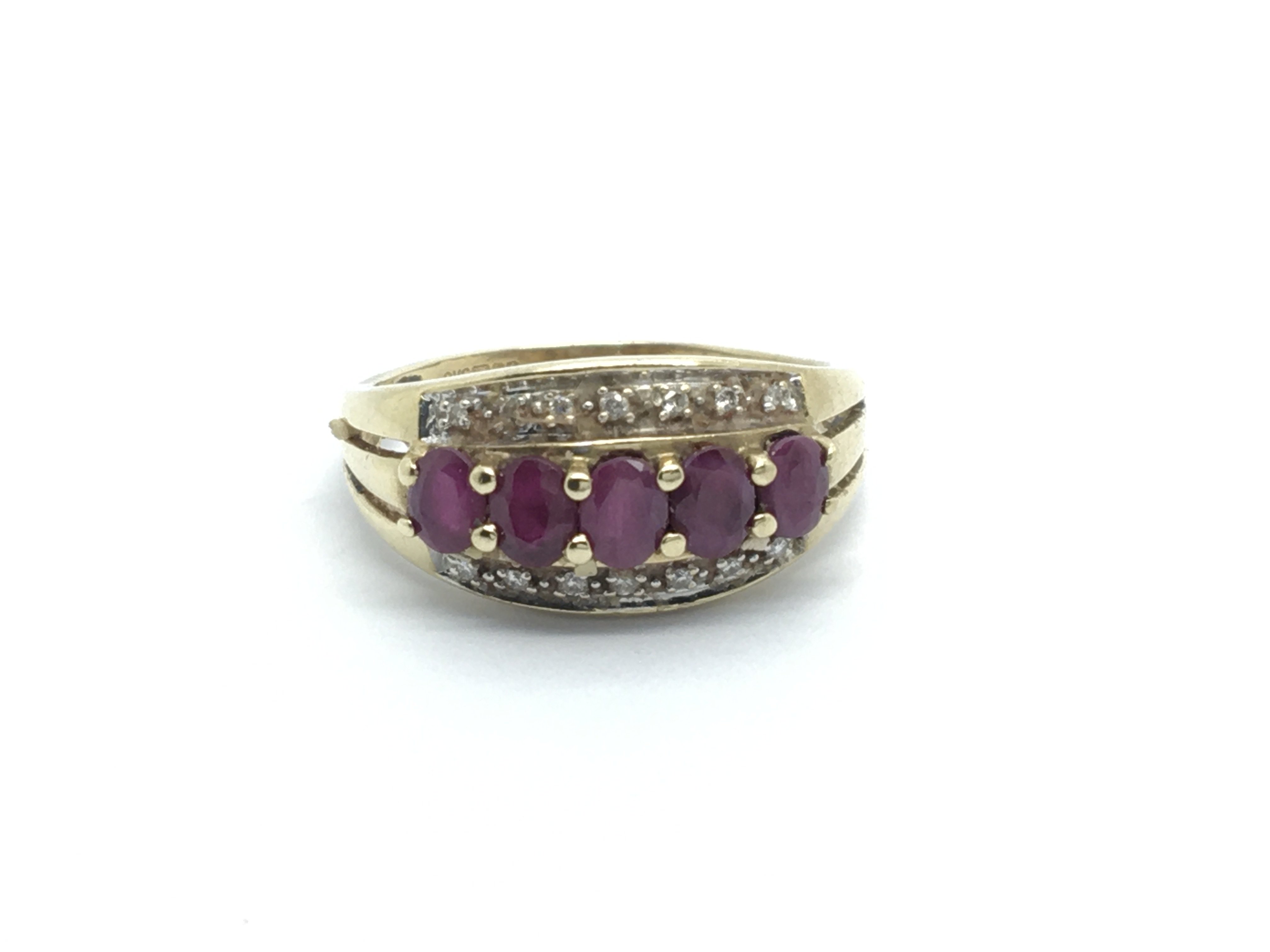 A 9carat gold ring set with ruby and small diamond