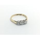 An 18carat gold ring set with three brilliant cut diamonds 0.33 of a carat.ring size N-O