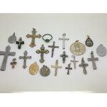 A collection of religious pendants and crosses.