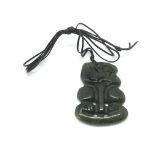 An antique New Zealand nephrite hei tiki pendant,