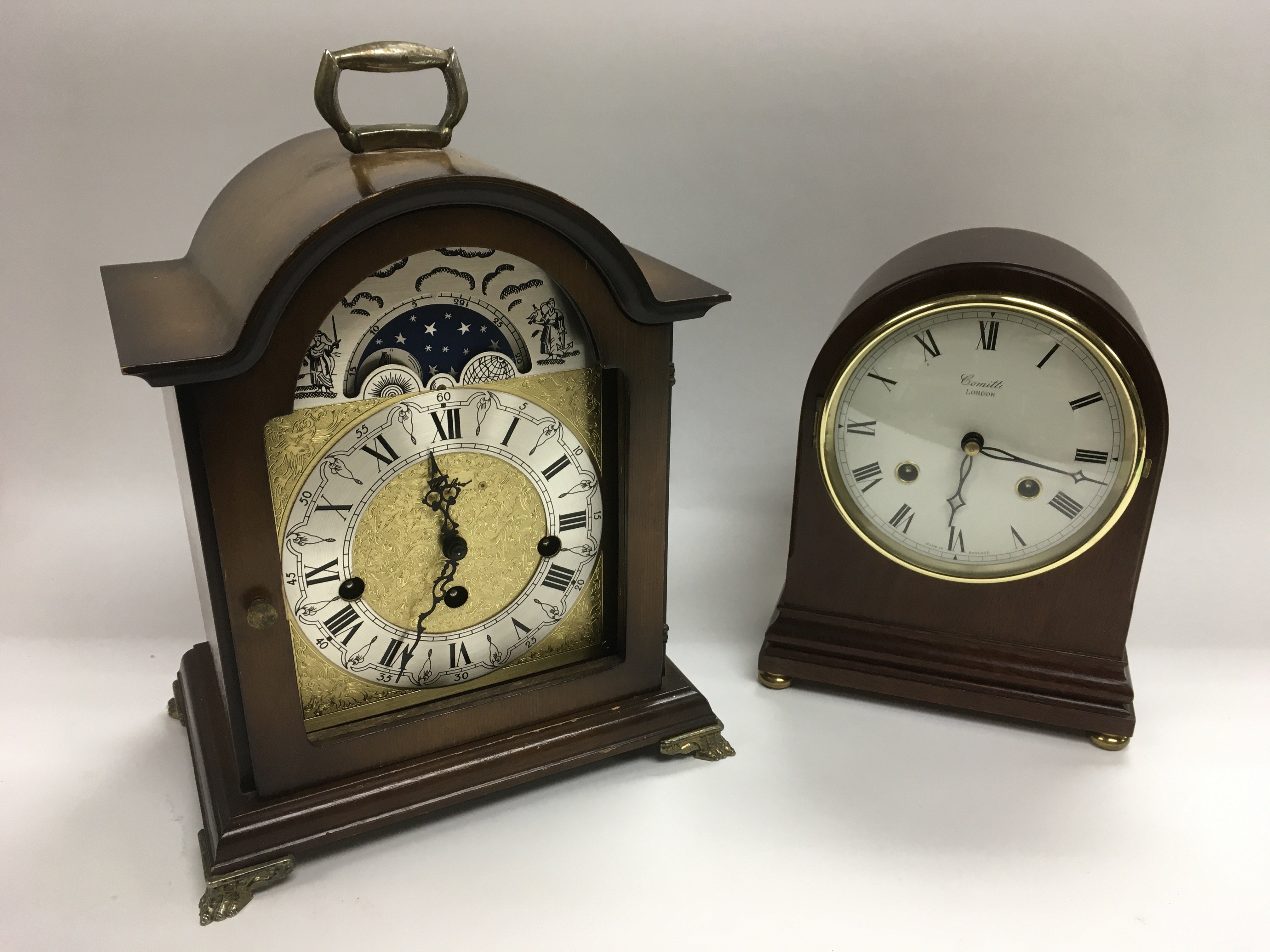 Two mantle clocks including one with a moon phase