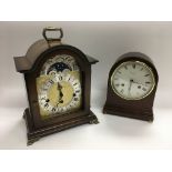 Two mantle clocks including one with a moon phase
