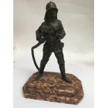 A Art Deco bronze figure in the form of a fireman