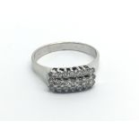 An 18carat white gold ring set with three rows of brilliant cut diamonds ring size M.