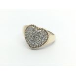 A 9carat gold ring set with a heart shaped pattern