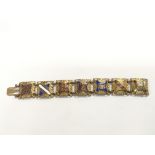 A good quality metal and enamel bracelet inset wit