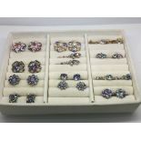 Twelve pairs of clip and screw vintage rhinestone earrings.