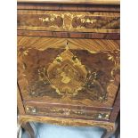 A marquetry cocktail cabinet with single drawer fall front on cabriole legs .120 by 130 cm