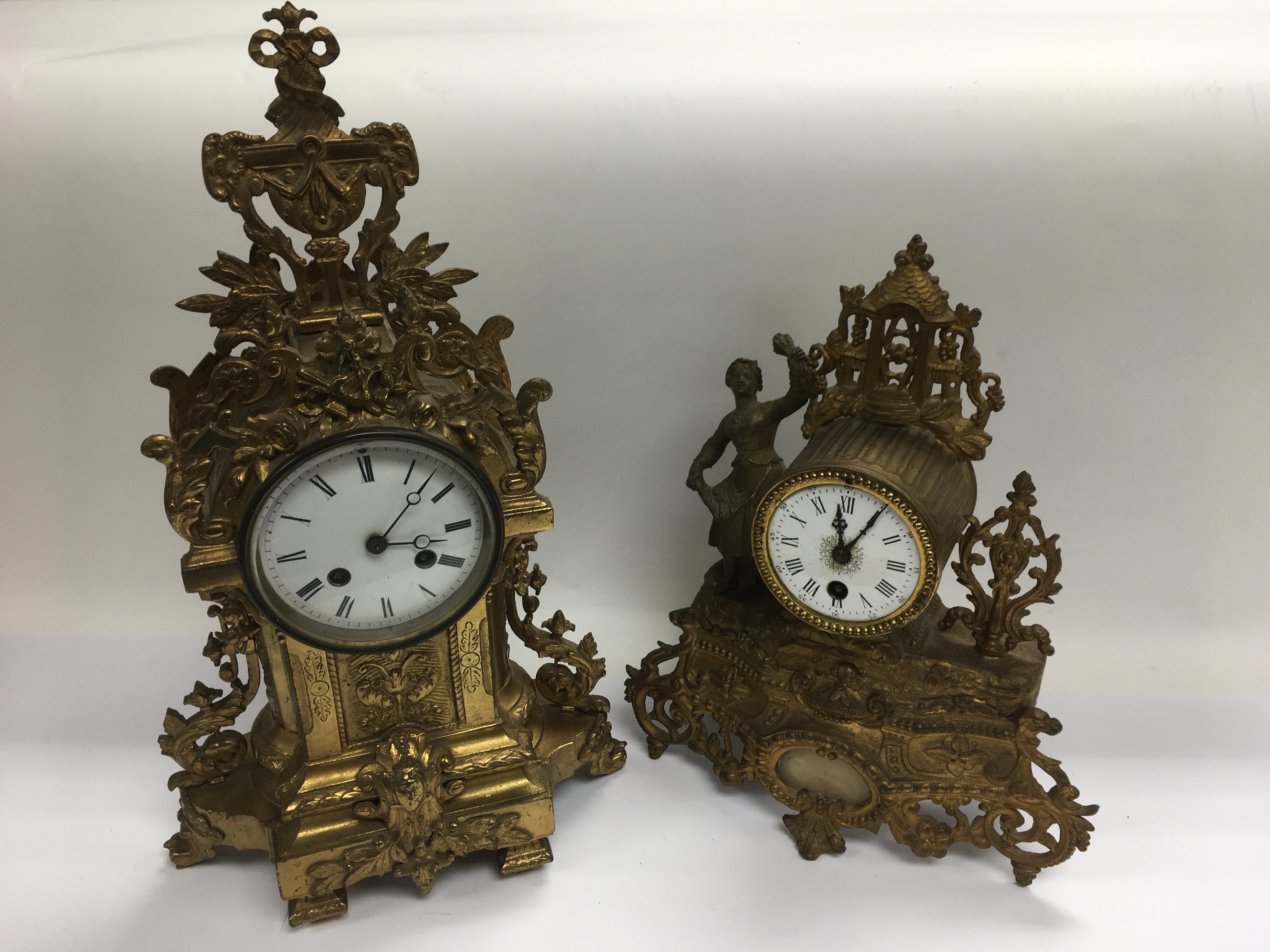 Two French giltwork figural mantle clocks.