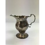 A silver cream jug, London 1773.