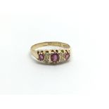 A Vintage 18carat gold ring set with three ruby an