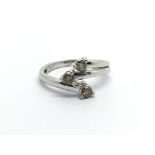 A modern design 9carat white gold ring set with ch