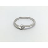 An 18carat white gold ring set with a solitaire di