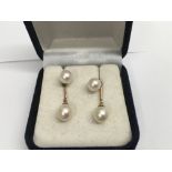 A pair of 18 ct yellow gold pearl drop earrings.