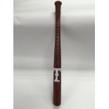 An American baseball bat with hand painted Texas R