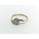 An 18carat gold ring set set with a pattern of diamonds ring size M