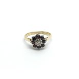 An 18carat gold ring set with a pattern of ruby an