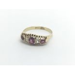 A Vintage18carat gold ring set with ruby and diamo