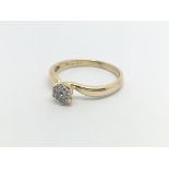 An 18carat gold ring set with a cluster of diamond