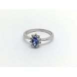 A Platinum ring set with a Ceylon sapphire flanked