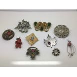 Ten costume brooches including a Giardinetto examp