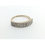 A 9carat gold ring set with two rows of brilliant cut diamonds approximately 0.50 of a carat