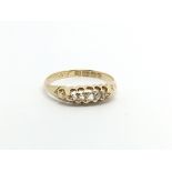 An 18carat gold ring set with a row of five diamonds ring size K-L