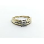 A 9ct gold solitaire diamond ring with further diamonds to the shoulders, approx.10ct, approx 2g and