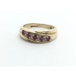 A 9ct gold eing set with rubies and diamonds, approx 3.2g and approx size I-J.