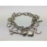 A nautical themed sterling silver charm bracelet,