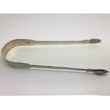 A pair of silver sugar tongs, London hallmarks.