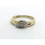 An 18ct gold three stone diamond ring, approx.10ct, approx 3.7g and approx size J.