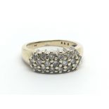 A 9ct gold ring set with three rows of diamonds, approx .55ct, approx 3.9g and approx size I- J.