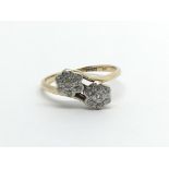 A Vintage 18carat gold ring set with two clusters of diamonds ring size K-L