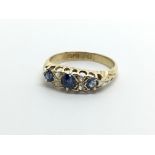 A vintage 18ct gold diamond and sapphire ring, app