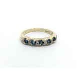 A 9ct gold diamond and topaz half eternity ring, approx 2.3g and approx size M-N.