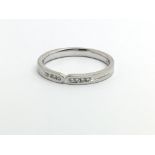 An 18ct white gold ring set with eight small diamonds, approx 2.7g and approx size M-N.