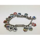 An enamelled silver charm bracelet