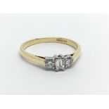 An 18ct gold ring set with three diamonds, approx 2.7g and approx size N-O.