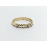 An 18ct gold and 22 diamond 2 row ring. (M/N), Approx 4g.