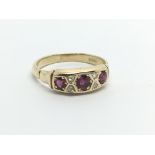 A vintage 18ct gold eing set with rubies and diamonds, approx 3.1g and approx size M-N.