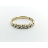 A 9ct gold half eternity ring set with seven diamonds, approx 1.5g and approx size N-O.