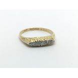 A vintage 18ct gold five stone diamond ring, approx 2.8g and approx size P.