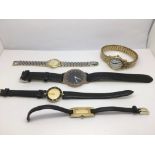 A collection of five watches including Gucci, Citi