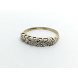 A 9ct gold seven stone diamond ring, approx 1.3g a